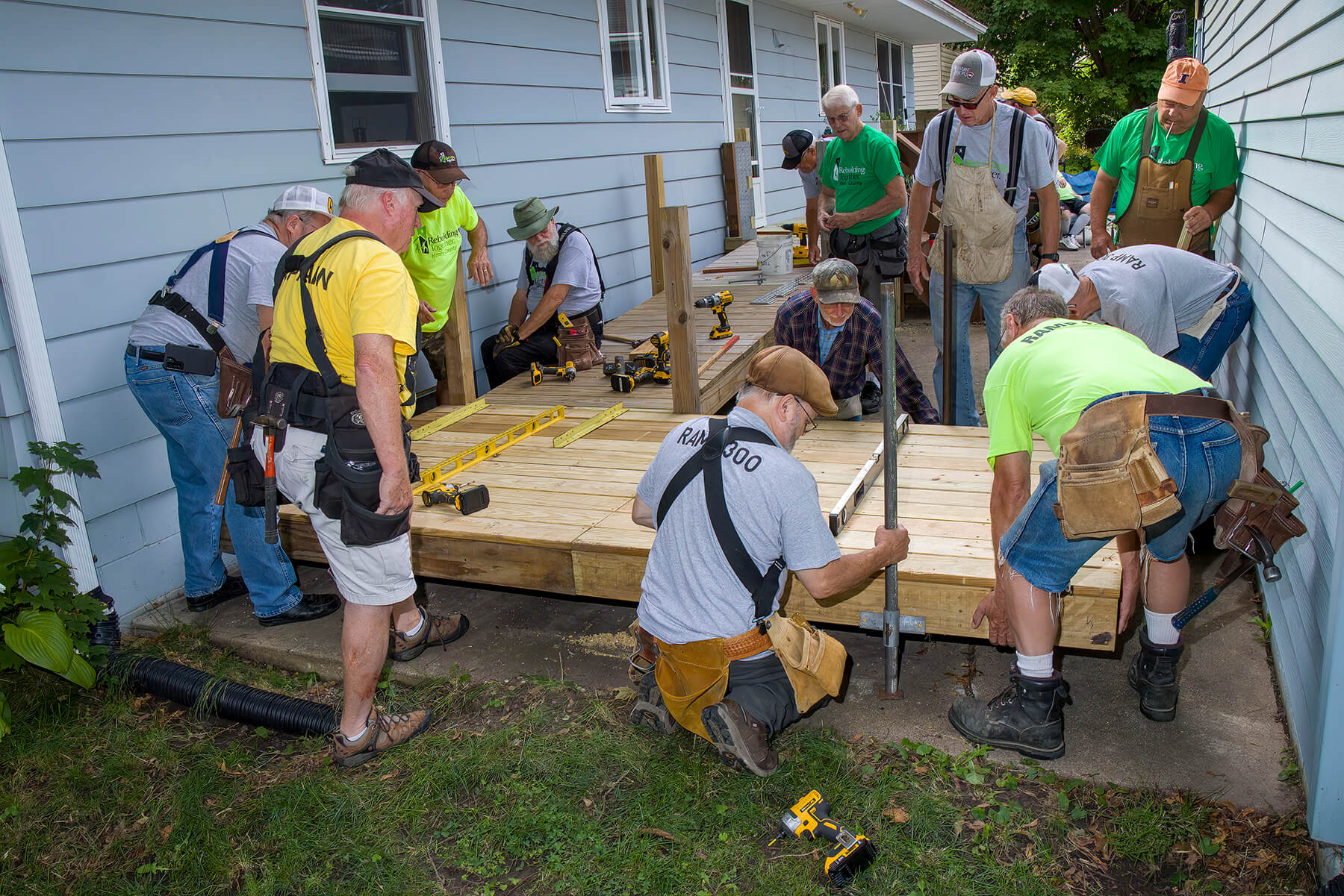 Volunteers constructing a wheelchair ramp